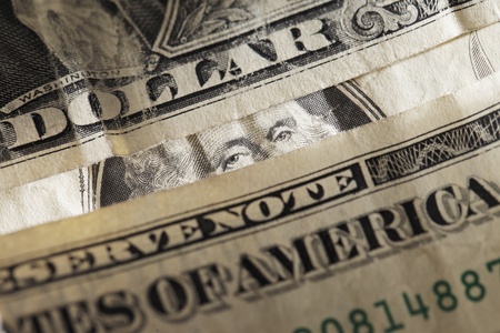 George washington lurking behind paper dollar money.