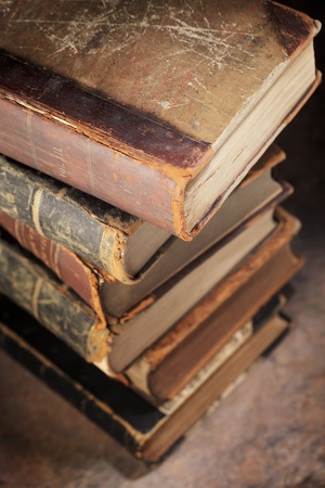 A Stack of old worn and tattered books. Short depth-of-field.の写真素材