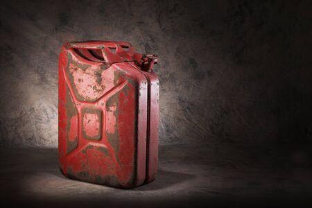 Old, dirty and rusty red jerry can fuel container.の写真素材