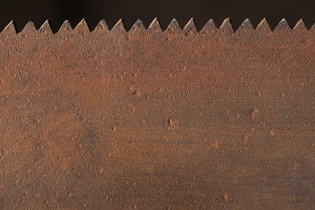 Old rusty saw blade in closeup.の写真素材
