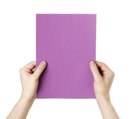 Man holding a blank purple paper against white background.の写真素材