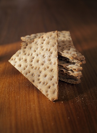 Swedish crisp bread on wooden table. Short depth-of-field.の写真素材