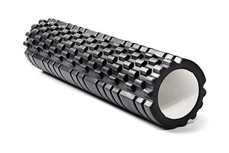 A black bumpy foam massage roller. Foam rolling is a self-myofascial release technique that is used by athletes and physical therapists to inhibit overactive muscles. A black bumpy foam massage roller. Foam rolling is a self-myofascial release technique that is used by athletes and physical therapists to inhibit overactive muscles.