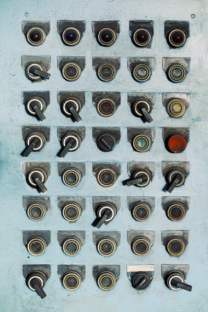 Switches and buttons at an old abandoned factory.の写真素材