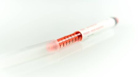 Trainer insulin pen with water inside for diabetic with text saying "water do not inject"の写真素材