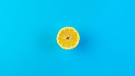Fresh Lemon fruit over blue background
