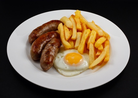Close up of Sausage, egg and chips  A traditional British Dishの写真素材