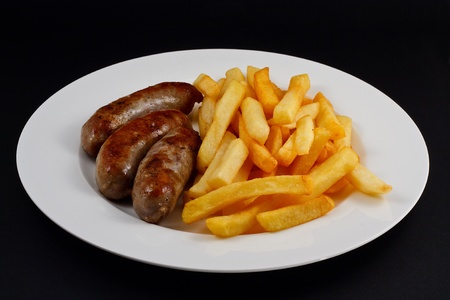 Close up of Sausage and chips  A traditional British Dishの写真素材