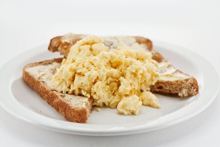 Scrambled eggs on toast close upの写真素材