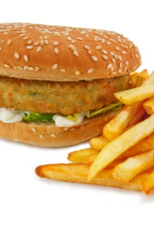 Close up of a breadcrumbed vegetarian or veggie burger and fries, could also be used for chicken burger or fish burgerの写真素材