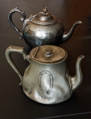 european traditional pewter teapots you might find in an antiques store or auctionの写真素材