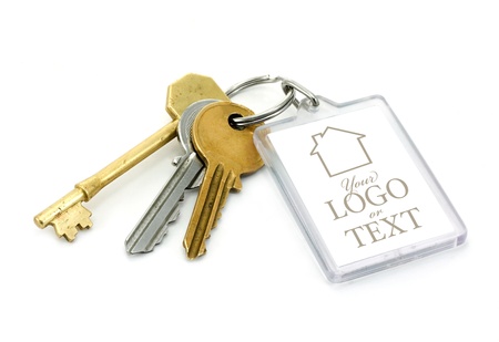 A set of house keys with clear plastic Key tab with copy space for adding of text message or estate agents company logo and details.の写真素材