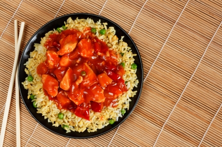 sweet and sour chicken with fried rice - popular oriental cuisineの写真素材