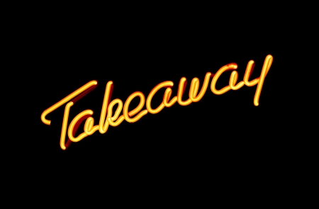 illuminated neon sign advertising take away or carry outの写真素材