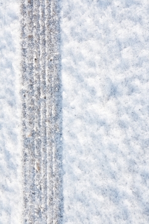 tyre tracks imprinted into fresh snow a great background for rallies or four wheel drive carstyの写真素材