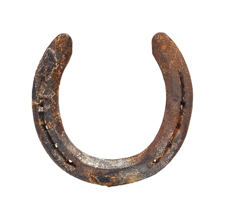 Old rustic horseshoe often hung on doors and said to bring good luck when hung the right way roundの写真素材