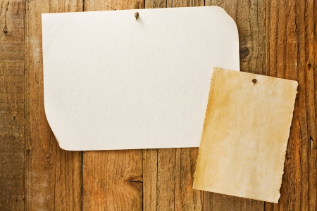 mottled beige parchment paper posters similar to the grungy cowboy wanted notices nailed to vintage wooden planksの写真素材