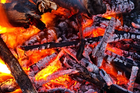 natural wood log fire embers glowing great for background or in solid fuel stoves now classed as a renewable power sourceの写真素材