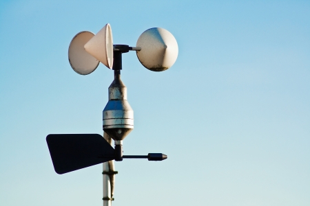Anemometer on weather station measuring wind speed for climate change trends and forecastingの写真素材
