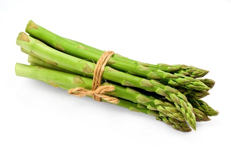 Asparagus bunch a premium seasonal vegetable isolated on a white background with light shadowの写真素材