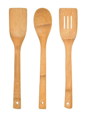 Complete set of bamboo kitchen utensils isolated against a white backgroundの写真素材