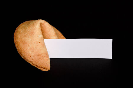 Chinese fortune cookie with blank paper strip for your own good luck messageの写真素材