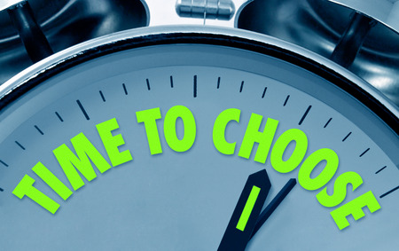 Time to choose proverb on the face of a traditional alarm clock with bells