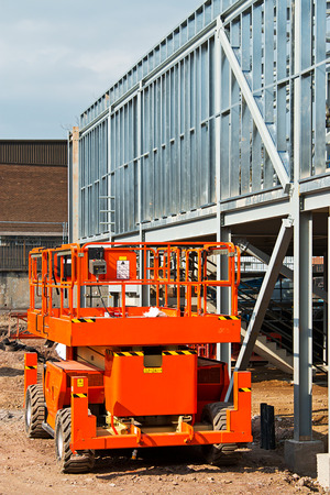 Self propelled diesel engined cherry picker a popular piece of construction equipment leased at plant hire depots for safe work at varying heightsの写真素材