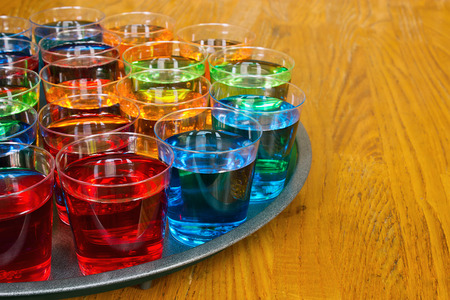 Drinks promotion with various shots on a tray to test as samplers or tasters for merchandising in the drinks industry.の写真素材