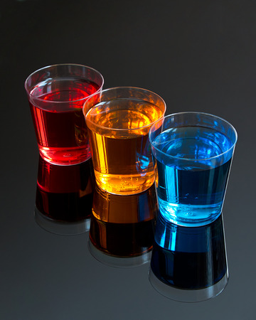 Abstract stylised picture of Three Shooters on a black background great concept for dinks offers at promotional eveningsの写真素材