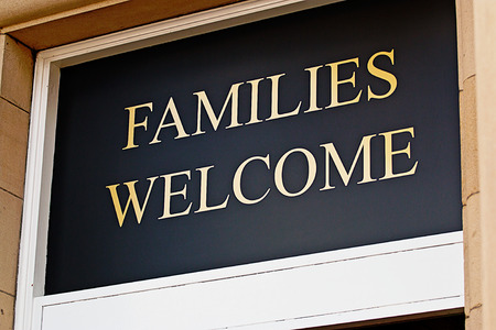 Families welcome sign outside restaurant inviting children to eat bar meals in selected licensed premisesの写真素材