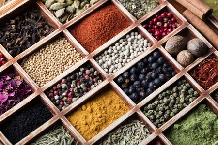 Dry colorful spices in bowlsの写真素材