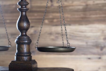 Law theme  scale of justice on wooden backgroundの写真素材