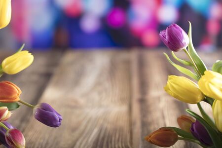 Easter theme. Bouquet of tulips. Easter eggs. Colorful bokeh