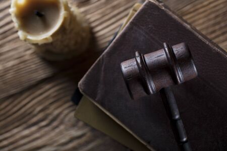 Law and justice theme. Mallet of judge. Legal code. Wooden table.の写真素材