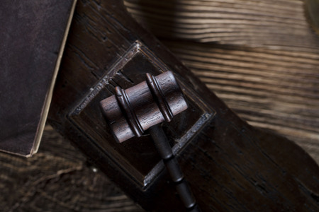 Law and justice theme. Mallet of judge. Legal code. Wooden table.の写真素材