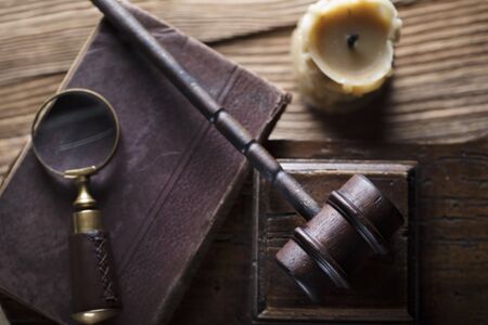 Law and justice theme. Mallet of judge. Wooden table.の写真素材