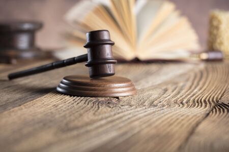 Law and justice theme. Mallet of judge. Legal code. Wooden table.の写真素材