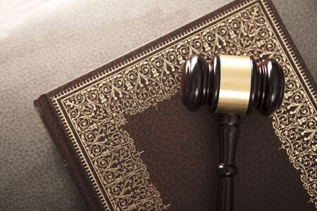 Legal system concept. Mallet of the judge and legal code as symbols of legal system.