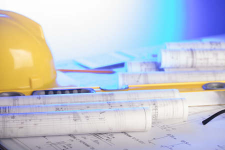 Construction blueprints with tools, top view.