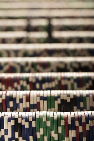 Casino concept. Stacks of poker chips. Colorful bokeh.の写真素材