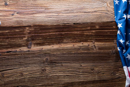 Independence Day concept. American flag on the wooden rustic table.の写真素材