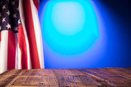 Independence Day concept. American flag on the wooden rustic table.の写真素材