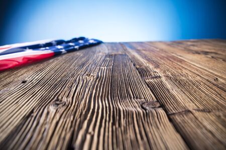 Independence Day concept. American flag on the wooden rustic table.の写真素材