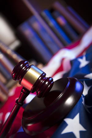 Independence Day theme. 4th of July. American Declaration of Independence. Gavel, library, different codes and american flag. Red and blue. Place for typography.の写真素材