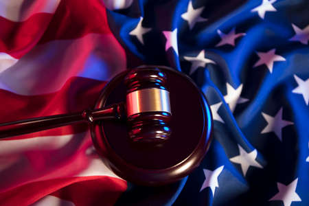 American law concept. Gavel of the judge and american flag