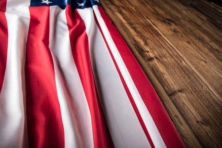 Independence Day concept. American flag on the wooden rustic table.の写真素材