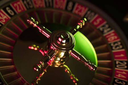 Casino theme. Gambling games. Closeup of the roulette wheel.の写真素材