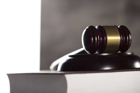 Judge concept. Gavel.  Gray stone background. Place for typography.の写真素材