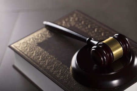 Judge concept. Gavel.  Gray stone background. Place for typography.の写真素材